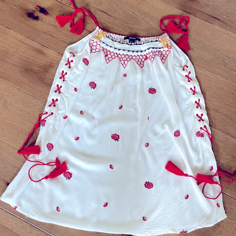 Embroidered top with tassels